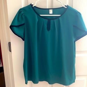 Green peephole blouse